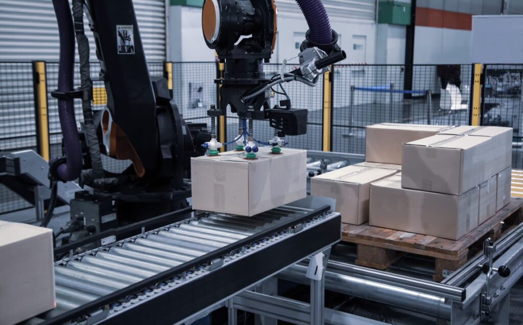 robot placing a package on the conveyor belt